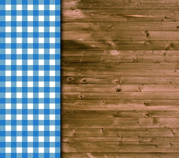 Fundo de madeira com toalha de mesa azul e branco — Fotografia de Stock