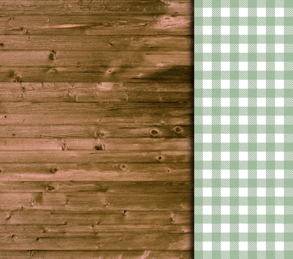 Traditionele houten achtergrond met groene wit tafellaken — Stockfoto