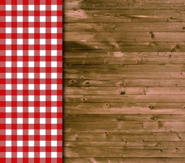 Traditionele houten achtergrond met rood wit tafellaken — Stockfoto