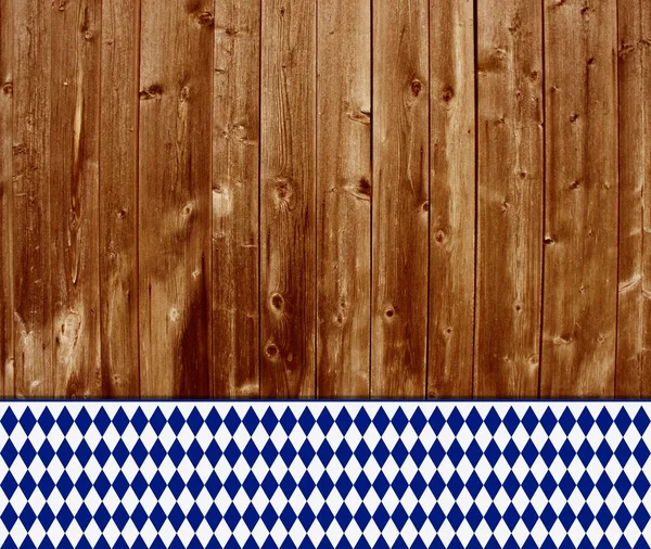 Traditioneller Holzhintergrund mit bayerischer Tischdecke — Stockfoto