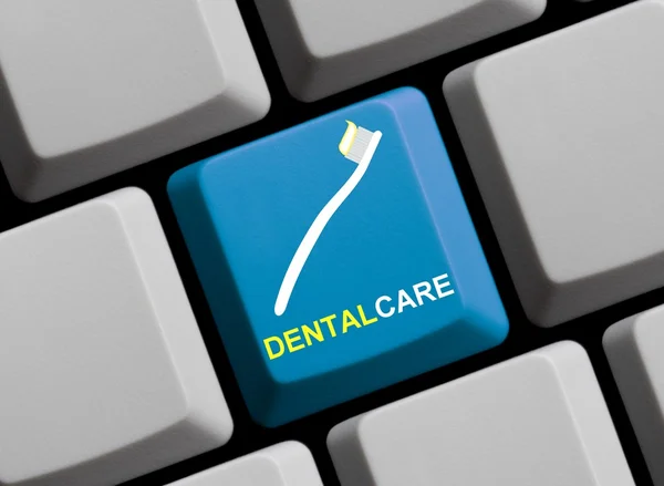 Teclado de computadora con símbolo que muestra el cuidado dental —  Fotos de Stock