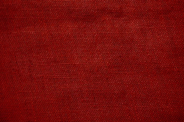 Antiga estrutura gunnysack fundo vermelho — Fotografia de Stock