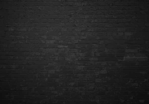 Old brick wall with black stones — Stock Photo, Image