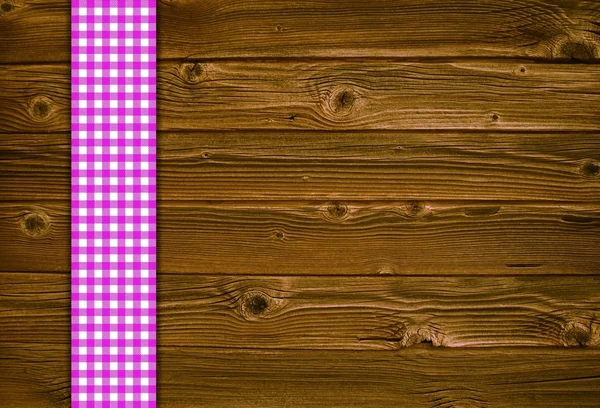 Holzplanken mit Vintage-Tischdecke rosa weiß — Stockfoto