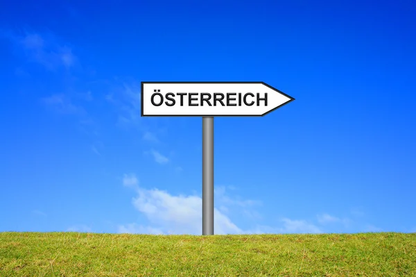 Signpost mostrando austria alemão — Fotografia de Stock