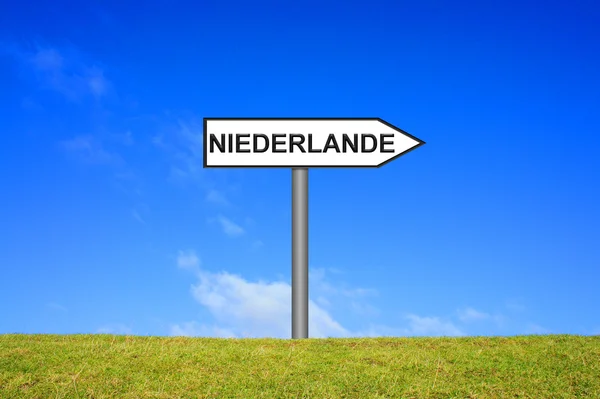 Signpost showing Netherlands german — Stock Photo, Image