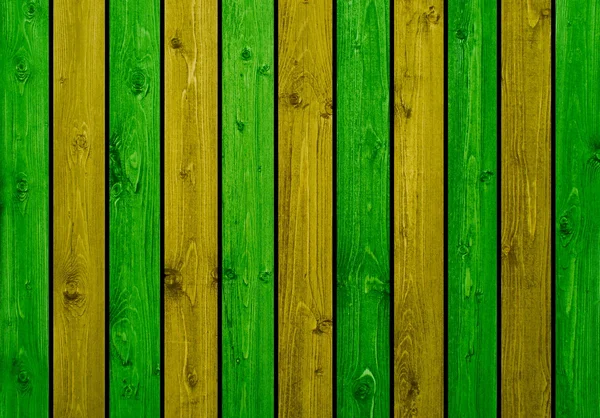 Tábuas de madeira fundo verde amarelo — Fotografia de Stock