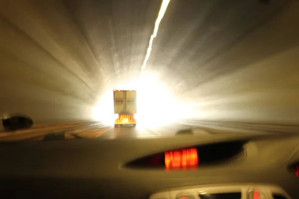 Driving through a tunnel on a road trip, playing with slower shutter speed and showing motion in action. The light at the end of the tunnel, showing the end of 2020 and hope for a better 2021.