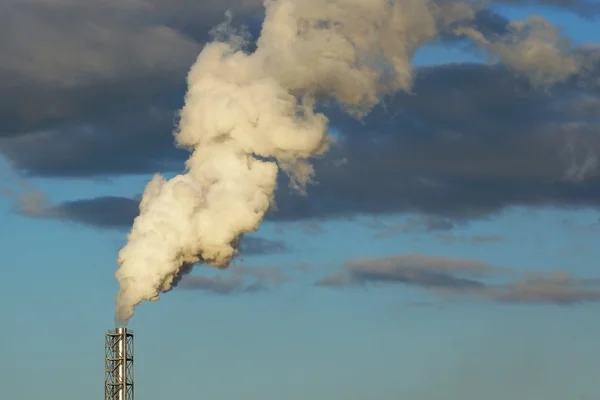 Smoke from a chimney on a blue sky — Stock Photo, Image