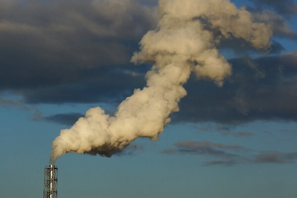 Smoke from a chimney on a blue sky