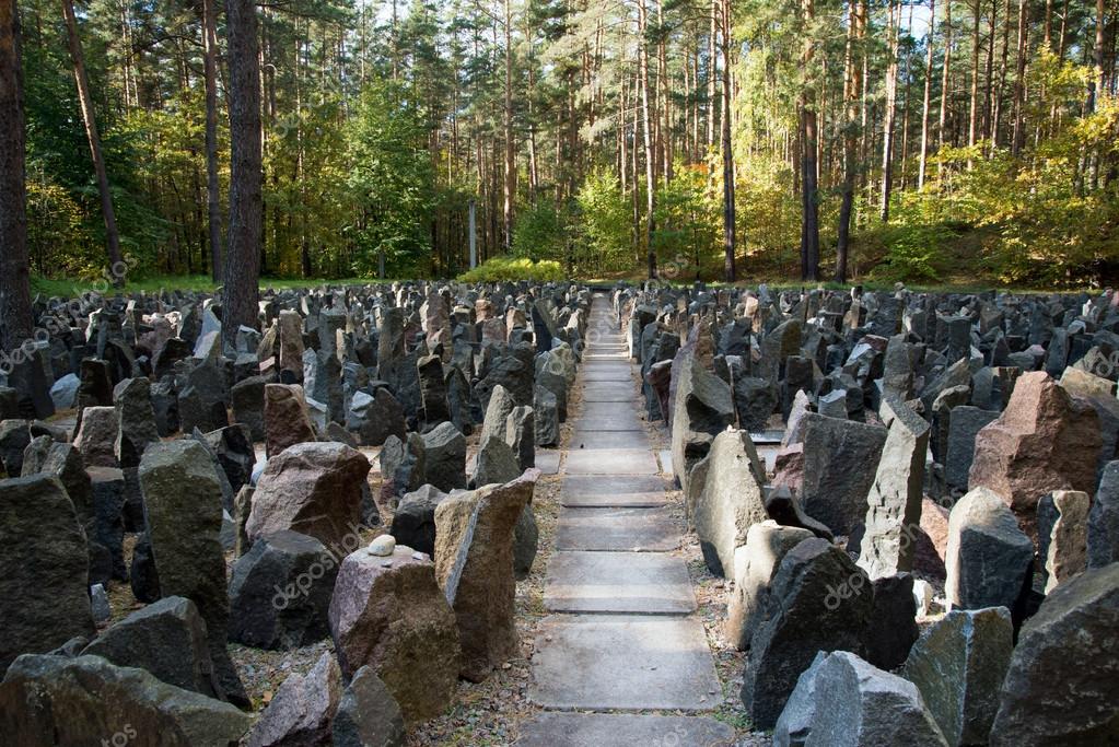 photo of a stone passage between rocks in the forest.