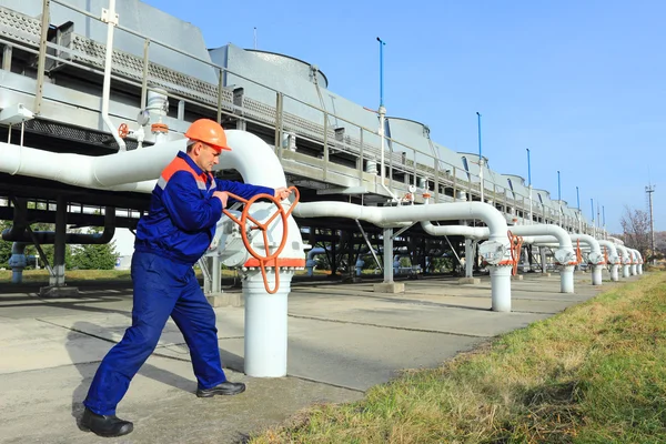 Worker opening valve — Stock Photo, Image