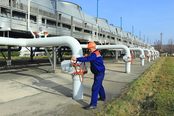 Worker closing valve — Stock Photo, Image