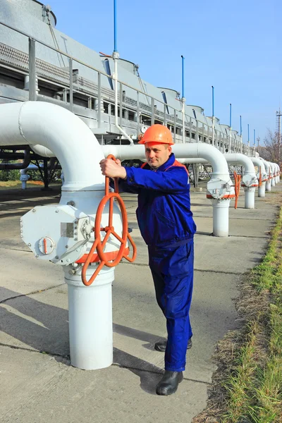 Worker closing valve — Stock Photo, Image