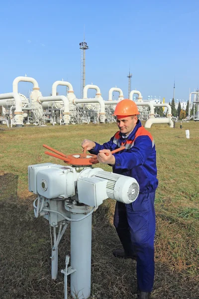 Worker opening bypass valve — Stock Photo, Image