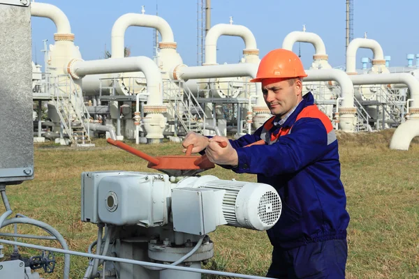 Worker opening bypass valve — Stock Photo, Image