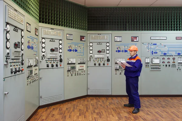 Engineer with log on main control panel — Stock Photo, Image