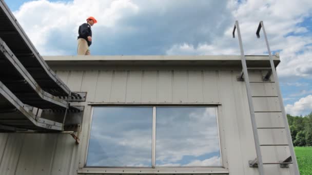 Worker Climbs Down — Stock Video