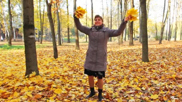 Woman Rotates With Leaves — Stock Video