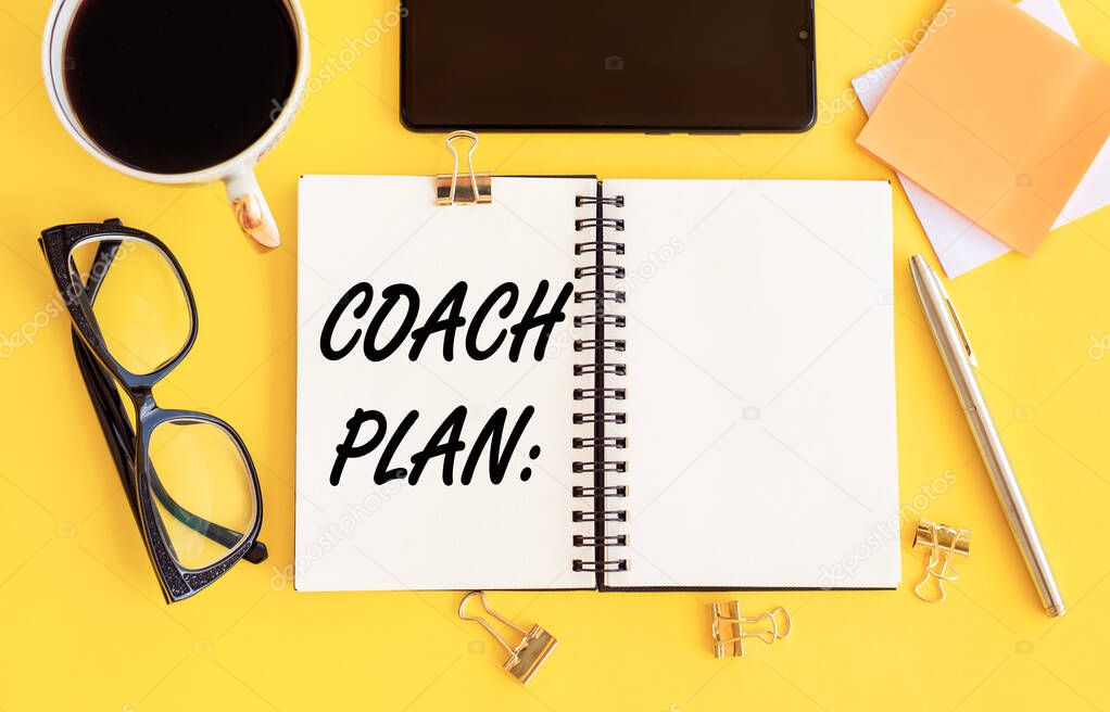 Business concept - Top view notebook writing Coach plan