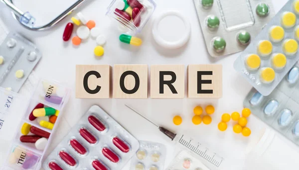 Core Word Medicine Wooden Blocks Table Medical Concept Pills Vitamins — Stock Photo, Image