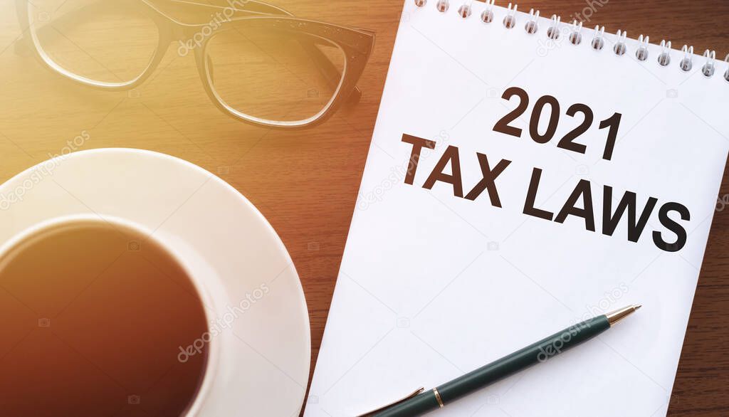 White paper with text 2021 tax laws, concept