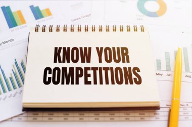 Finansal dokümanlar üzerine bir kalemle birlikte bir deftere yazılmış COMPETITION metninizi bilin.