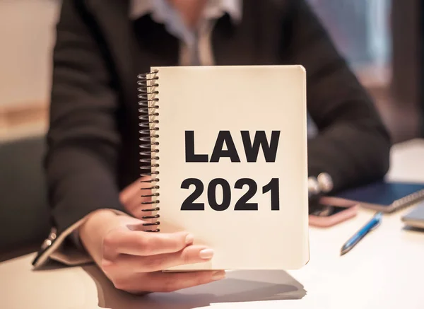 Business Woman Holds Notebook Text Law 2021 — Stock Photo, Image