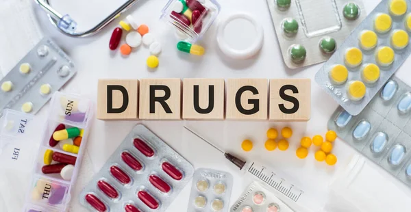 Words Drugs Wooden Blocks Desk Medical Concept Pills Vitamins Stethoscope — Stock Photo, Image