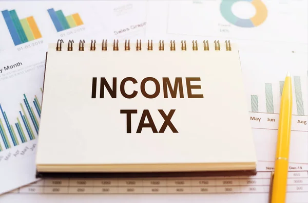 Φόρος Εισοδήματος Λέξεις Σημειωματάριο Στα Οικονομικά Διαγράμματα Επιχειρηματική Έννοια — Φωτογραφία Αρχείου