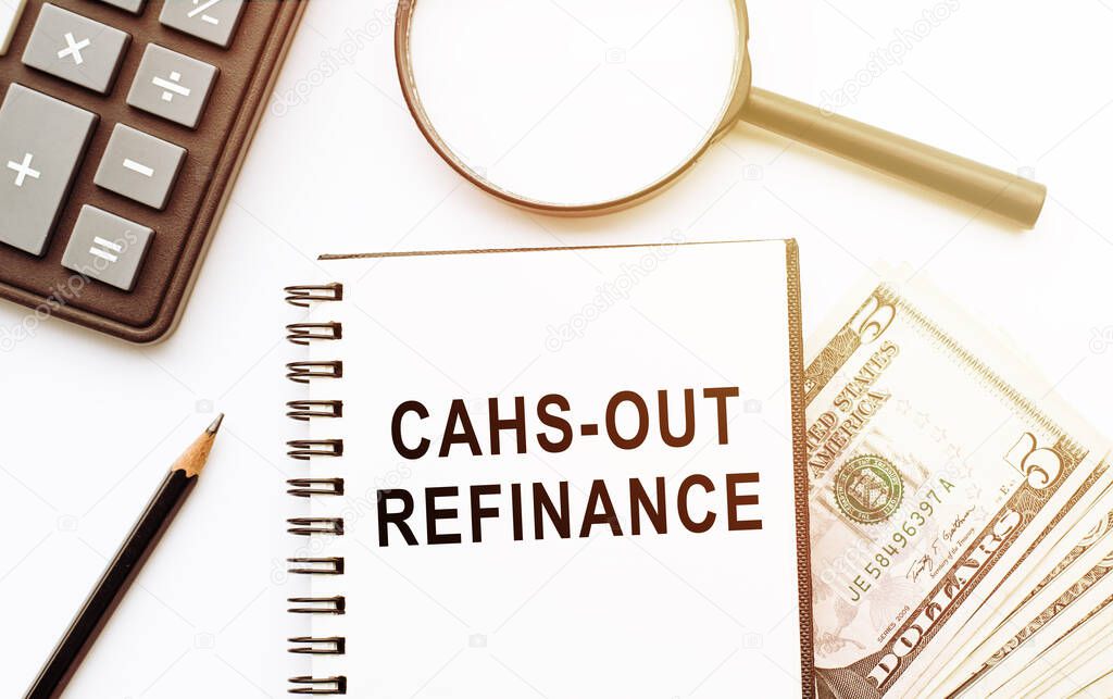 Cash out refinance on documents and dollars, calculator and magnifier