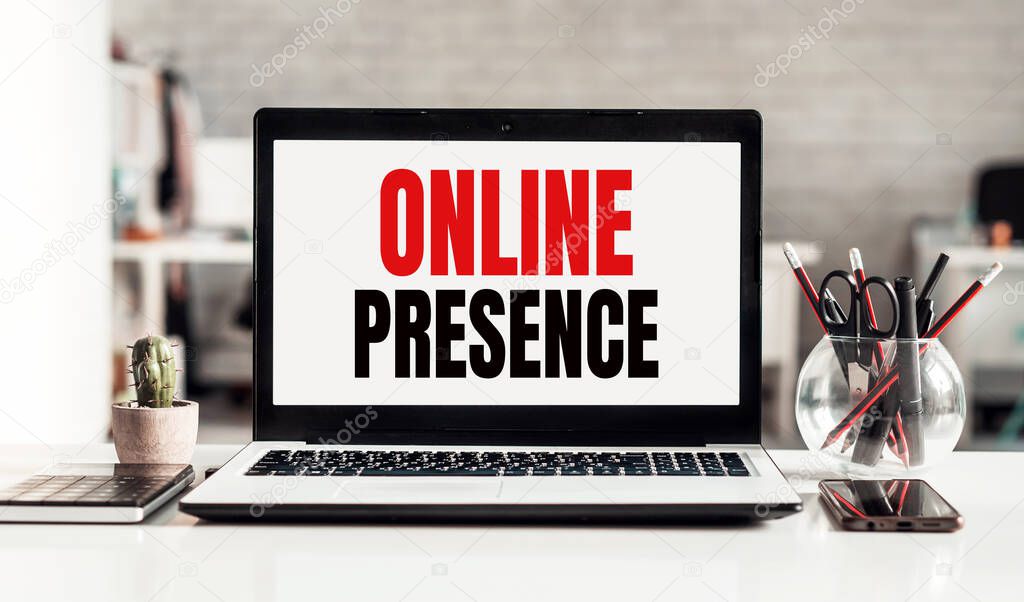Laptop with ONLINE PRESENCE text on modern office background.