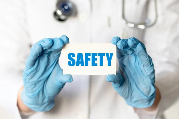 Medical Worker Gloves Holds Card Words Safety Medical Concept — Stock Photo, Image