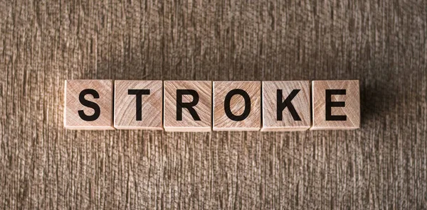 Stroke Woord Geschreven Houten Blokken Een Bruine Achtergrond — Stockfoto