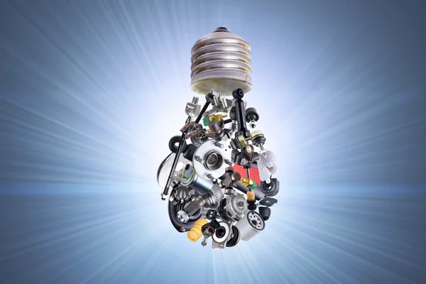 Electric bulb with auto parts — Stock Photo, Image