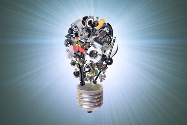 Electric bulb with auto parts — Stock Photo, Image