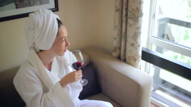 Young beautiful girl in a bathrobe — Stock Video