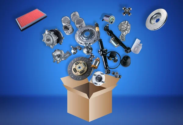 Many spare parts flying out of the box — Stock Photo, Image