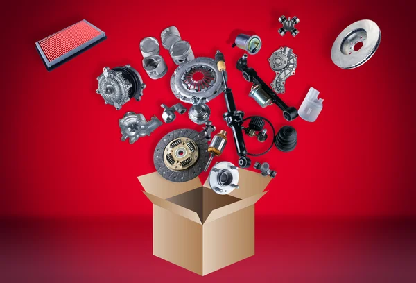 Many spare parts flying out of the box — Stock Photo, Image