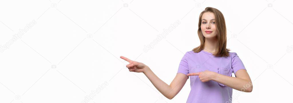 Portrait of stylish confident girl pointing finger left at interesting offer, recommend click link, upload app or subscribe. Studio shot, white background