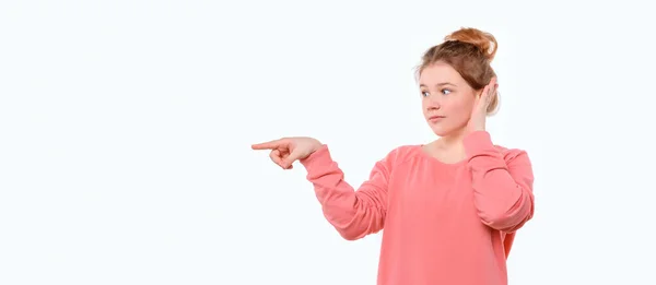 Look Here Surprised Young Girl Pink Casual Sweatshirt Pointing Finger — Stock Photo, Image