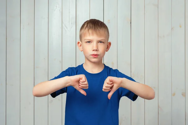 Serious Preteen Boy Blue Shirt Showing Thumb Expressing Dislike Studio — Stock Photo, Image