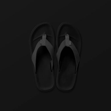 Parmak arası terlikler siyah arkaplanda izole edilmiş. Üst görünüm ve boşluk kopyala. Terlikler siyah.
