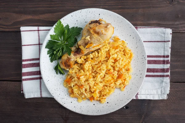 Delicious Asian Pilaf Stewed Rice Vegetables Chicken Drumstick Plate Wooden — Stock Photo, Image