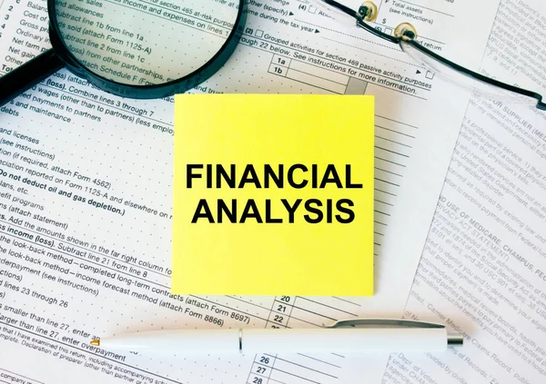 Yellow Sticker Text Financial Analysis Financial Docs Notepad Magnifying Glass — Stock Photo, Image