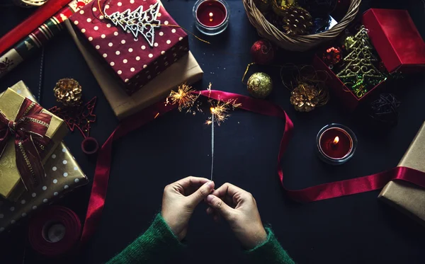 Overhead shot of Christmas presents and wrapping papers