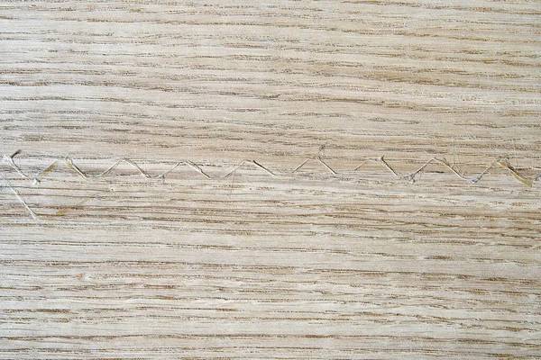 Oak texture as background. Spliced oak veneer with glue thread for furniture manufacturing closeup
