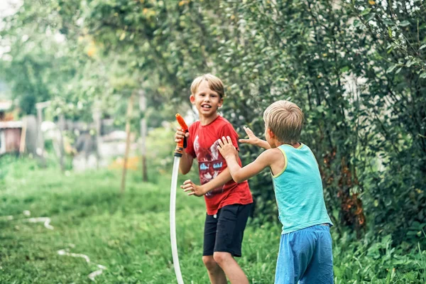 Joyful Funny Boy Cute Little Brother Plays Water Hose Green — Stock Photo, Image