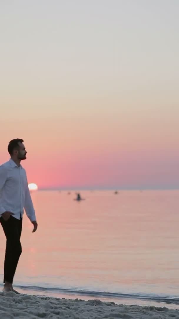 Vertical Video Man Trousers Shirt Walking Seashore Dawn Stock Footage