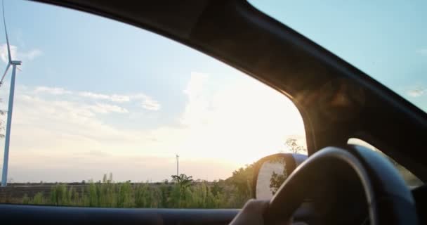 Large Working Wind Turbine Sunset Seen Driver Window Car — Stock Video